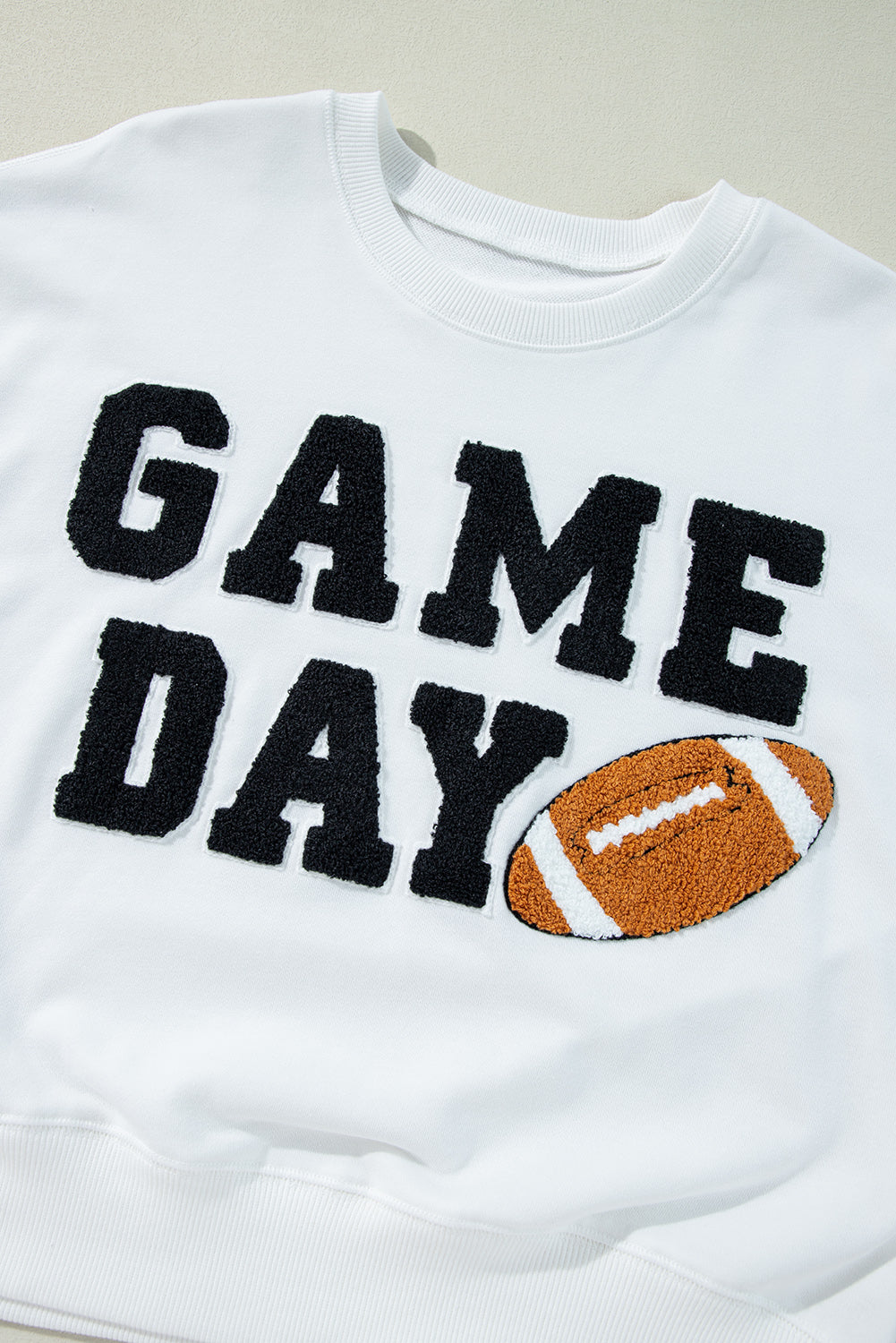 THE FOOTBALL GRAPHIC SWEATSHIRT